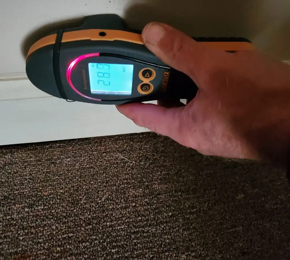 Moisture detection at baseboard during Storm Damage Restoration in Somers